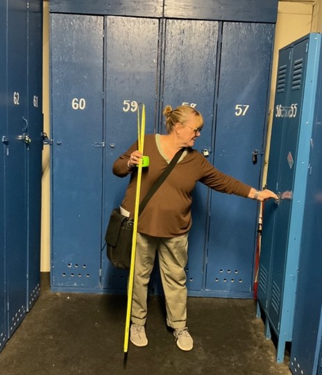 Eppley staff Kate Wiltz reviews the space available in a public locker area of the Mt. Ashland Ski Area